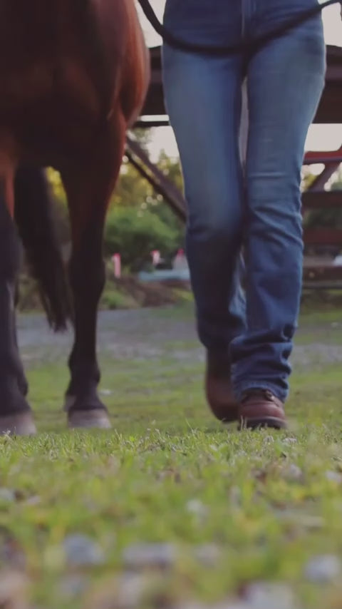 A female barn manager receives LASTING PINNIP's dark brown steel toe work boots, Pangolin